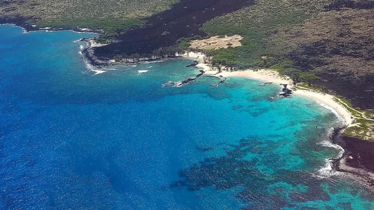 Aerial shot over island of Hawaii ocean