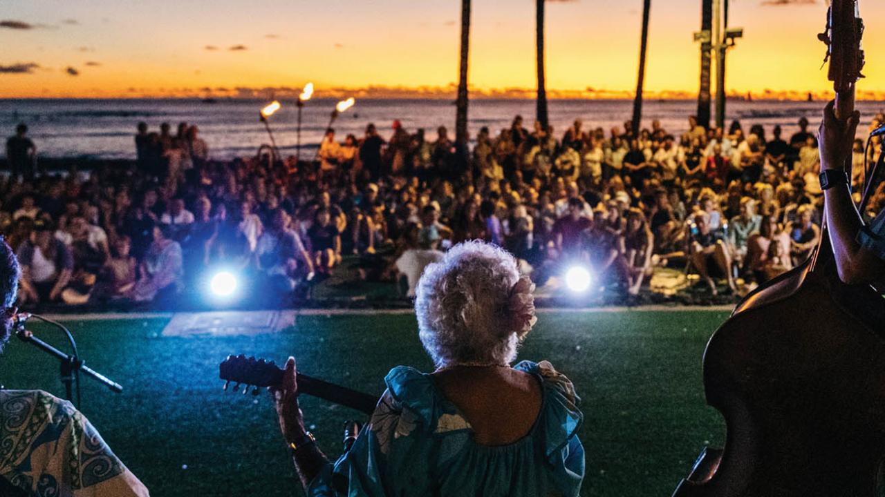 Live music at sunset with crowd on Oahu