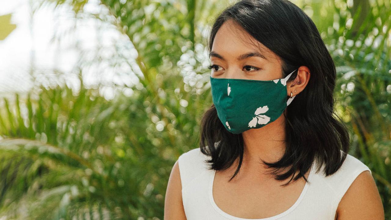 Woman wearing mask - Safe Travels Program