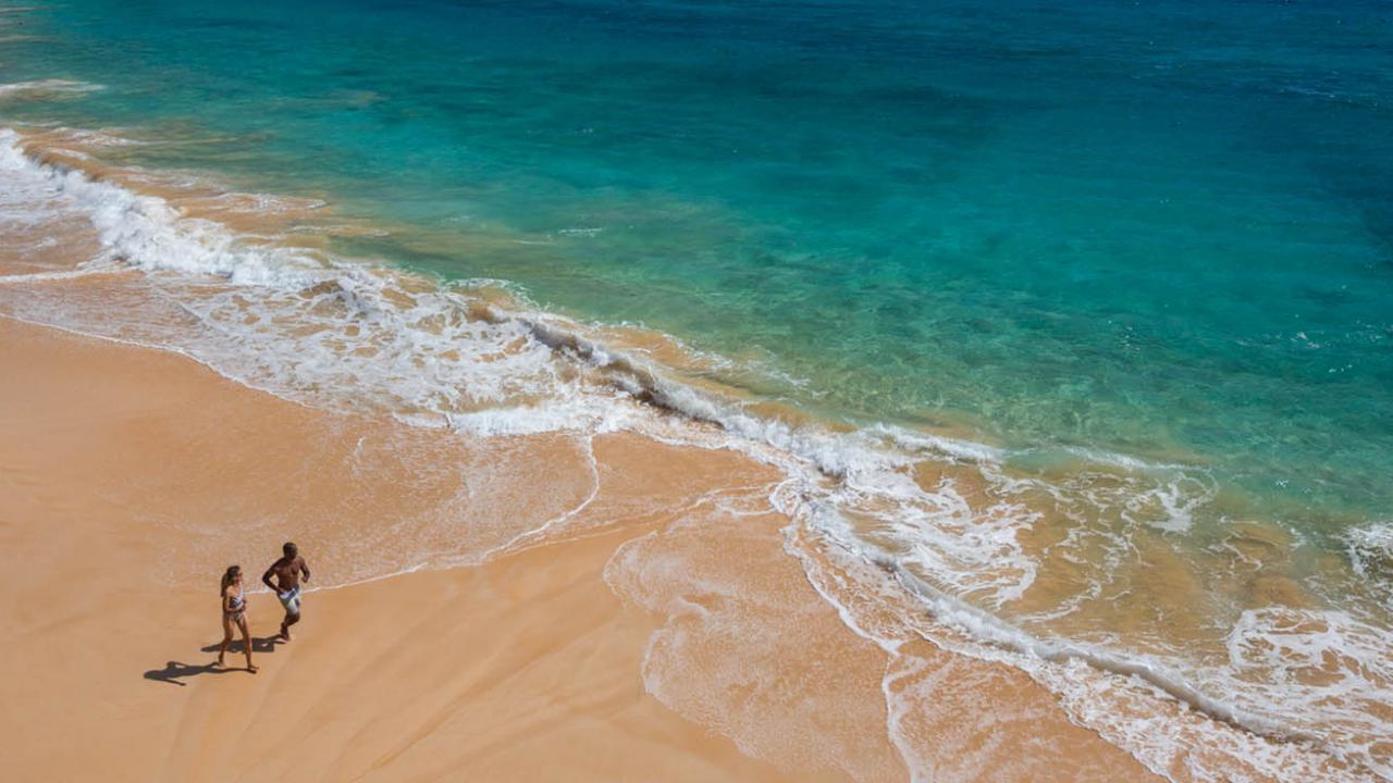 Beach shot on Oahu with couple