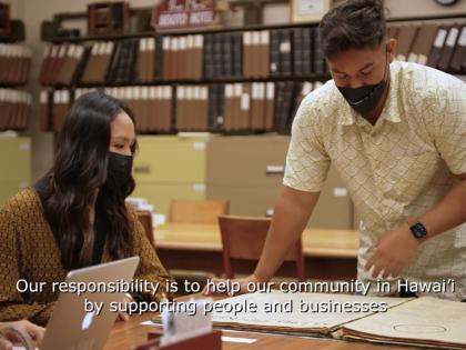 Hawaiian Native woman and man working on translations for Hawaii Newspaper to digitize