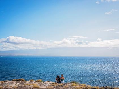 Women lookout over Maui coastline