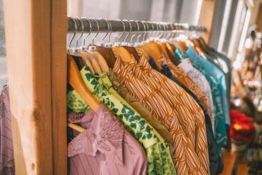 mens shirts hanging on a store rack