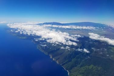 Aerial of Hamakua coastline with Maunakea and Maunaloa in background